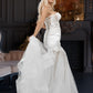 Long wedding dress with semi-transparent model and tulle train EVM-1024
